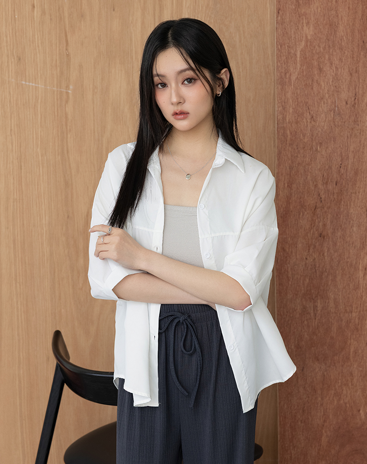 LONGLINE CURVED CUT PUFF SLEEVE BLOUSE